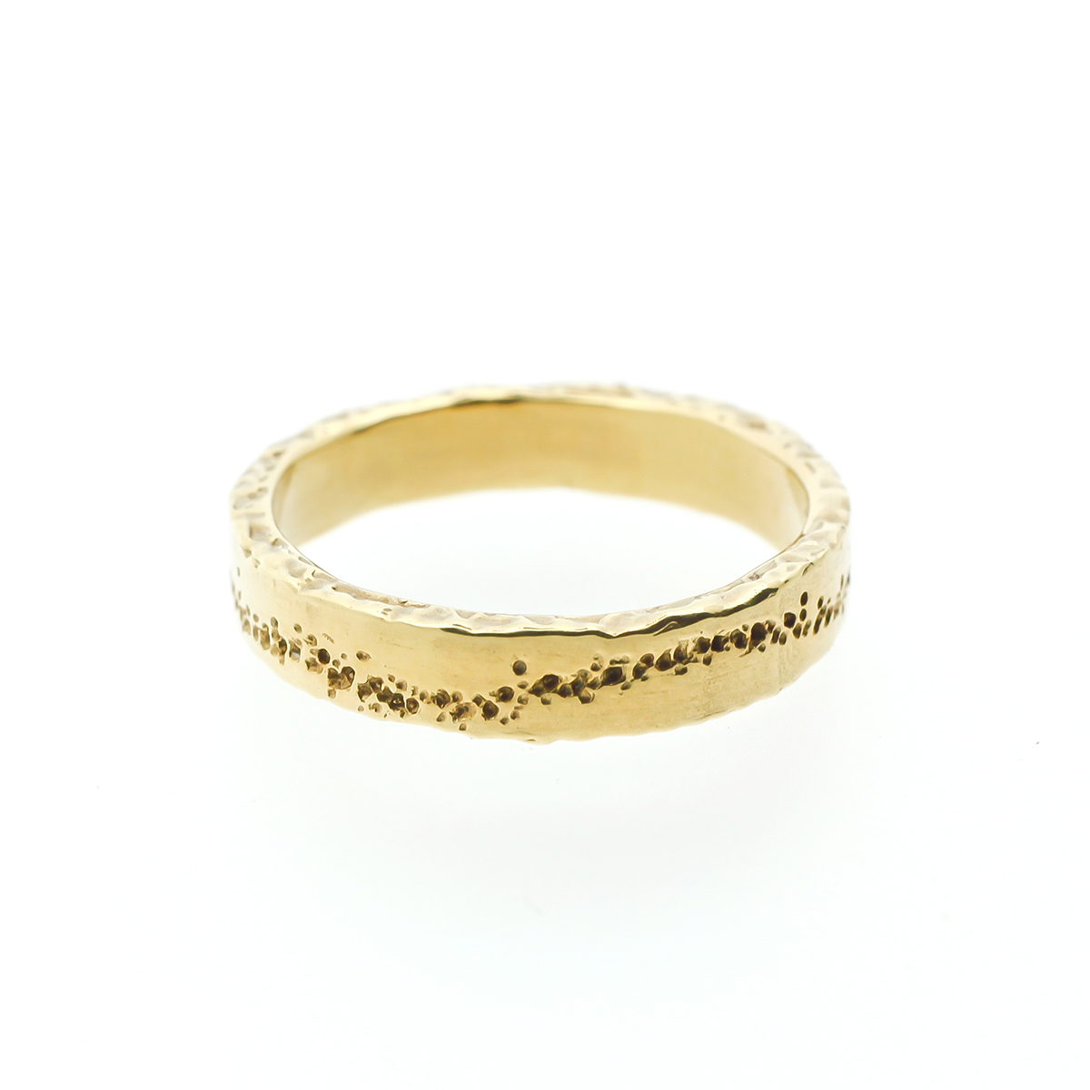 Golden wedding ring with original line in the band
