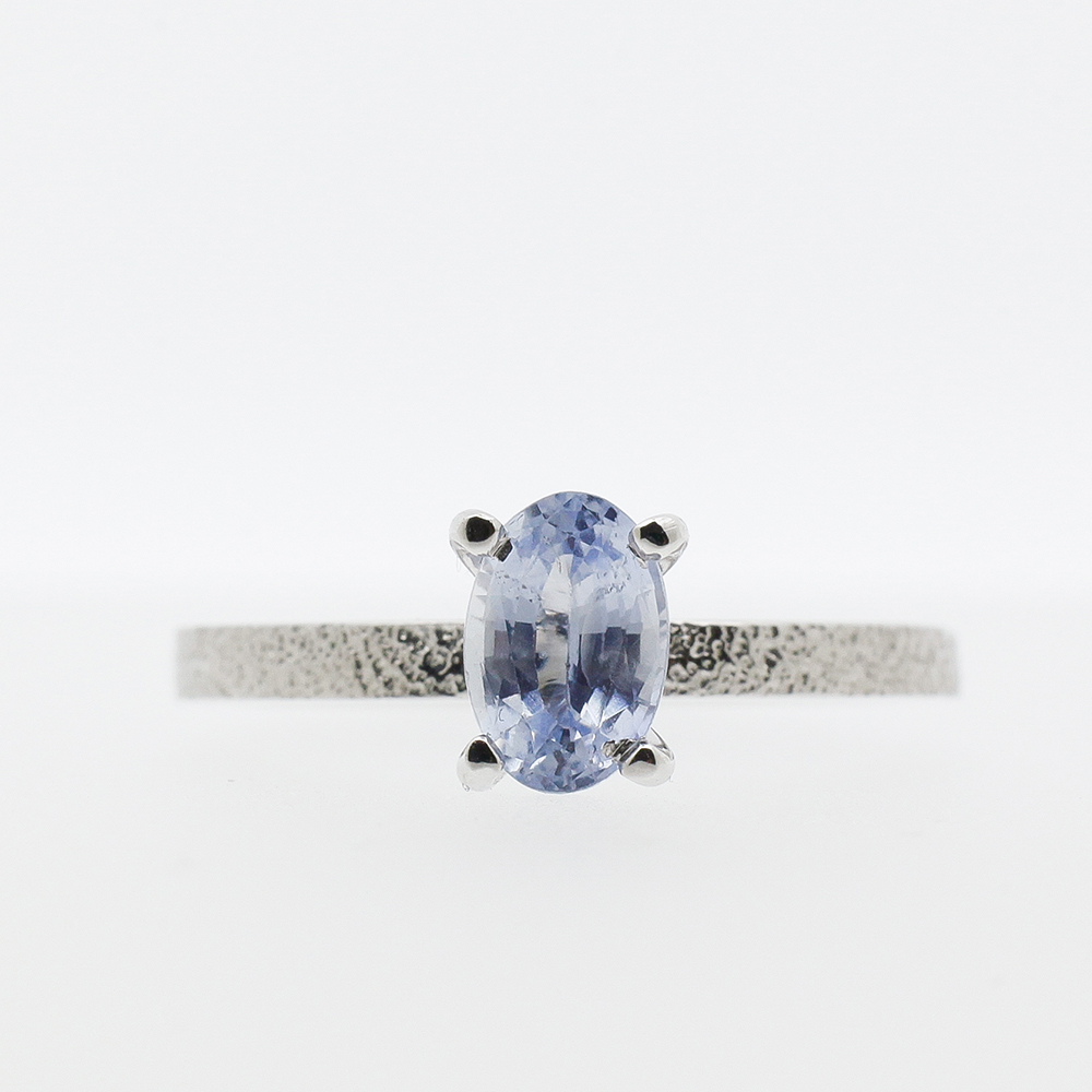 Wite gold ring with light blue sapphire