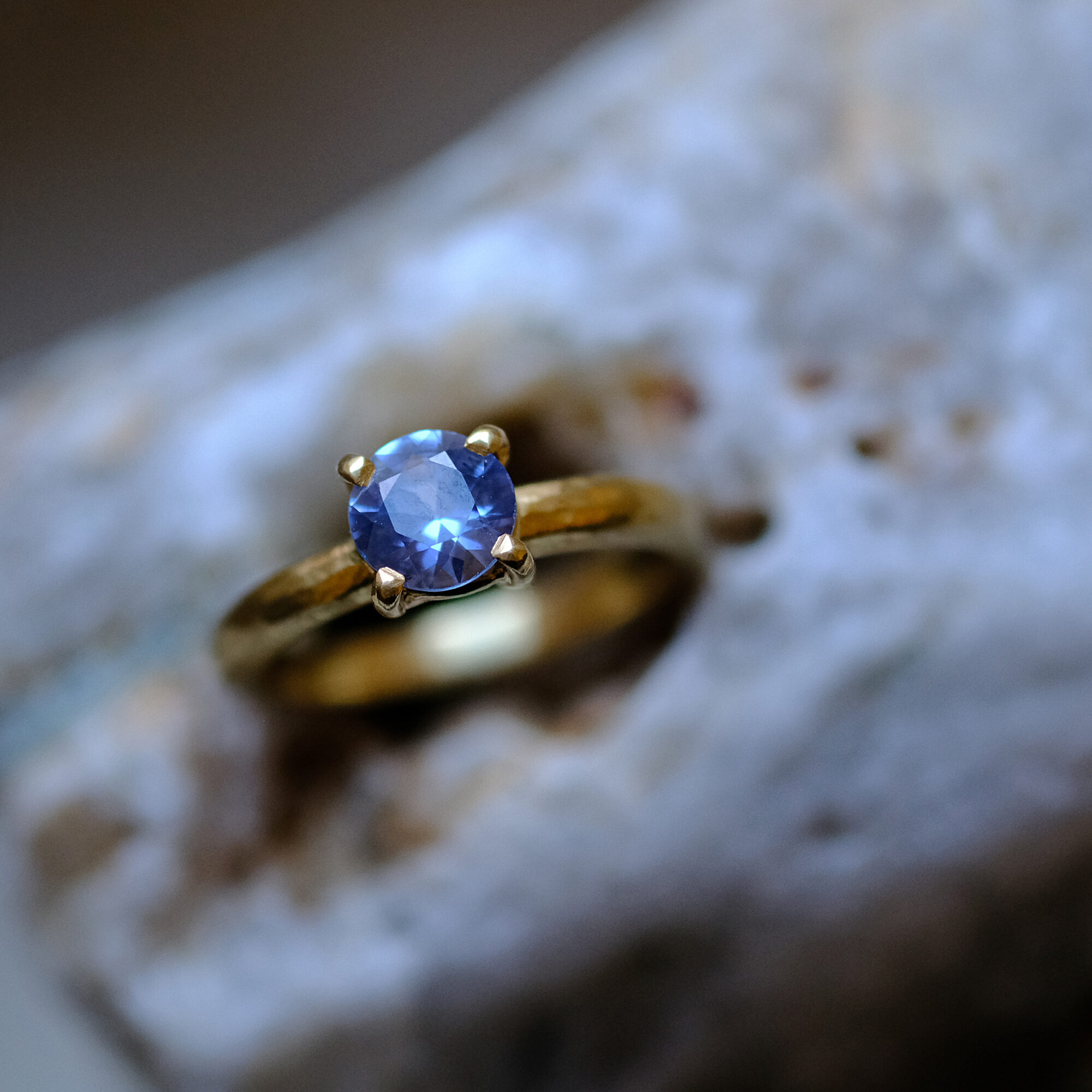 yellow gold with blue sapphire